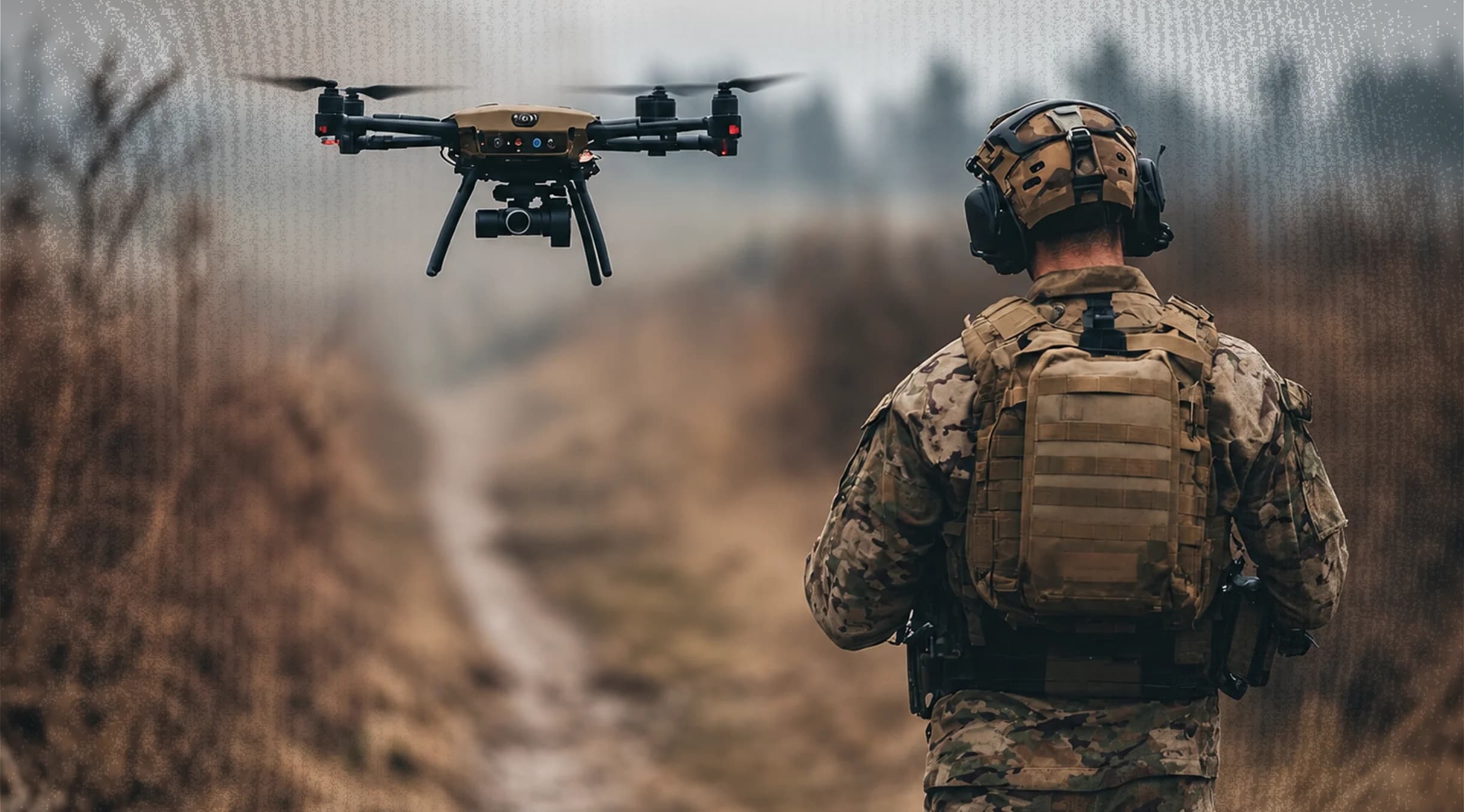 Soldier with a drone in an outdoor enviroment